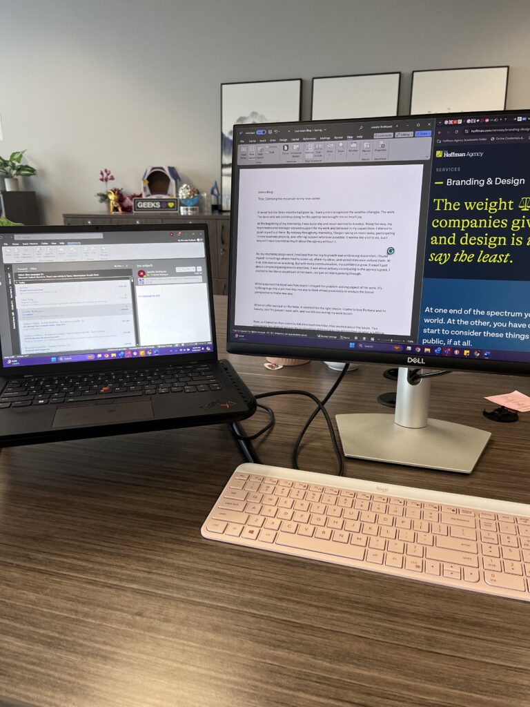 Desk with monitor, laptop and keyboard setup